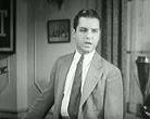 screen shot of actor Eric Linden from 1938 movie "Here's Flash Casey"