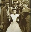 stil from "The Harvey Girls" 1946 movie, with Judy Garland packing two sixguns