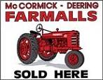 white 'Farmalls Sold Here' tin sign